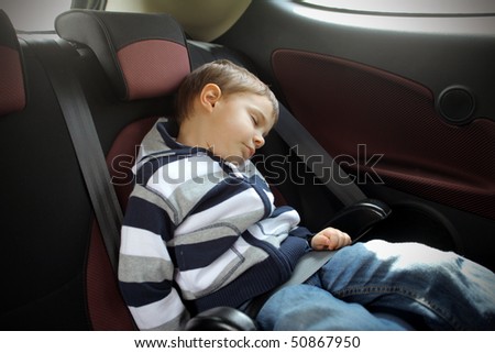 Child sleeping in a car