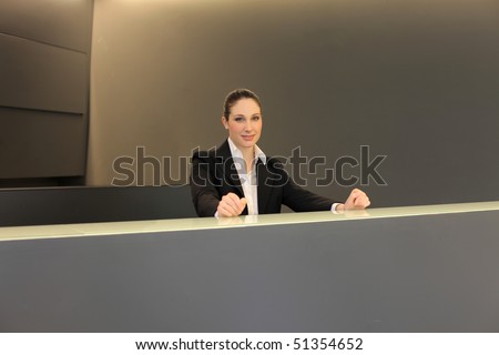 smiling woman at the reception desk
