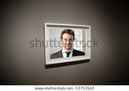 Frame showing the portrait of a smiling young businessman