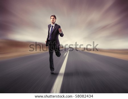 a businessman running on the road