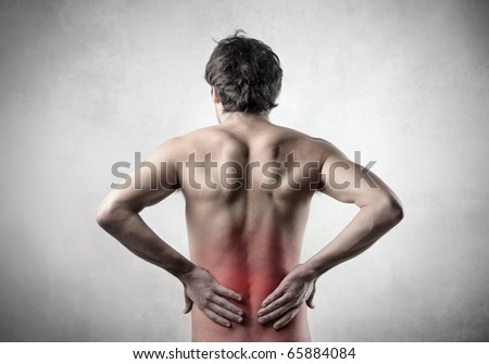 Rear view of a man with backache