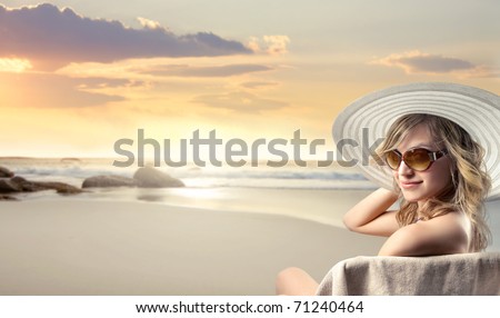 Beautiful woman in swimsuit at the seaside