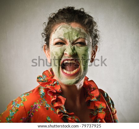 Angry woman wearing a face mask and screaming
