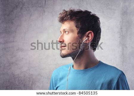 Profile of a young man listening to music