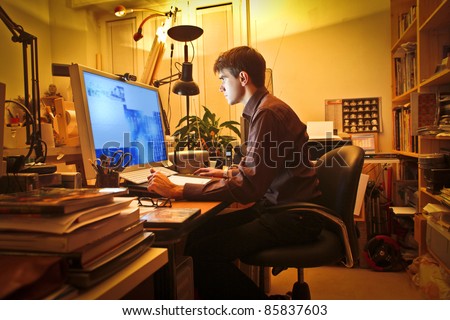 Young man at home using a computer
