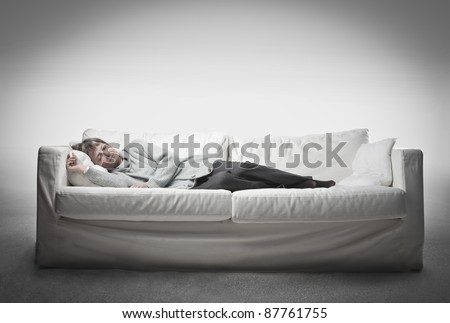 Senior woman sleeping on a sofa