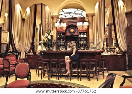 Beautiful woman sitting in the lounge of a luxury hotel