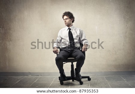 Young businessman sitting on an office chair