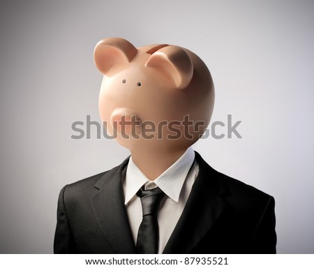 stock photo : Businessman with moneybox instead of his head