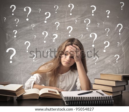 Stressed teenage girl doing her homework