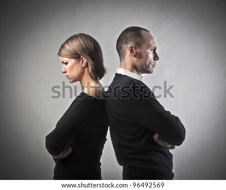 Angry couple turning their back on each other