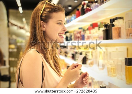 Woman smelling different scents