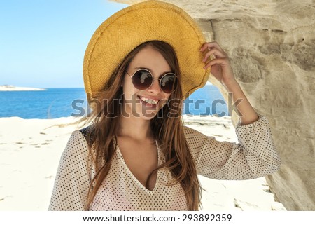 Beautiful woman smiling at the beach
