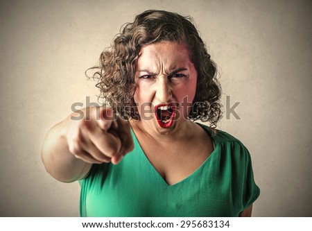Angry woman judging someone