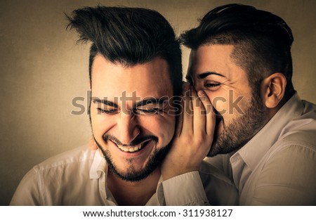 Men whispering secrets