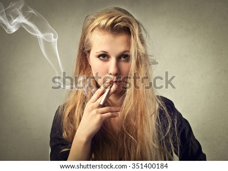 Similar – Foto Bild Teenager-Mädchen mit Rauchzeichen am Strand