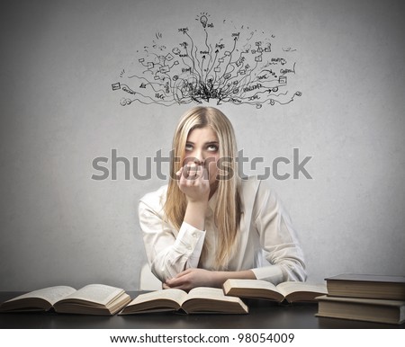 Young student with thoughtful expression sitting at a desk on some books with tangled lines and symbols coming out of her head