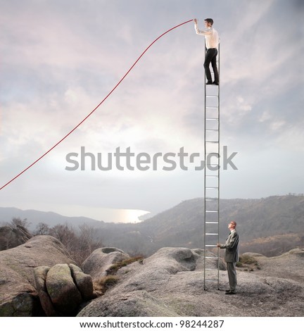 Businessman holding a ladder on which another businessman stands and charts a positive trend graph