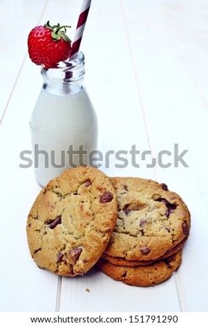 Strawberry milk with three warm cookies