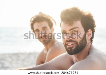 Portrait. Couple of friends at sunset on the beach on a day of rest summer vacation together, after spending a day of relaxation and fun