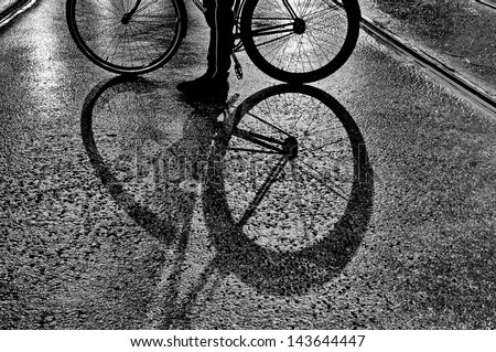 Strange shadows of the wheels of a bike