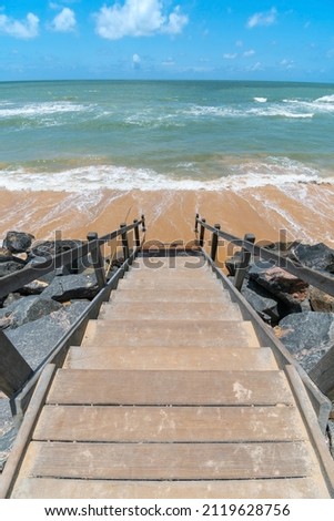 Beachfront landscape of a wooden stair leading down to the sea, beautiful blue sky day. Boa Viagem beach in Recife, PE, Brazil. Imagine de stoc © 