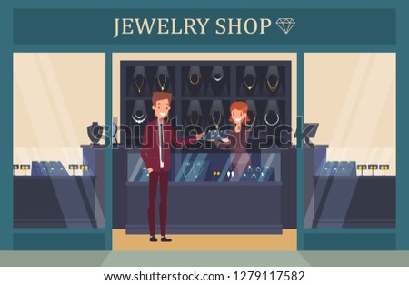 Jewelry shop showcase with man choosing ring