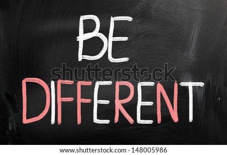Be different handwritten with chalk on a blackboard