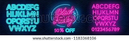 Black Friday neon lettering on brick wall background with the alphabet ストックフォト © 