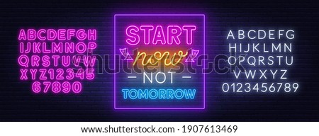 Start now not tomorrow neon quote on a brick wall.