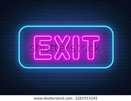 Exit neon sign on brick wall background.