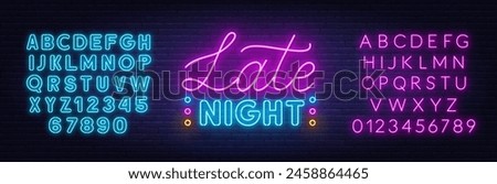 Late Night Neon Sign on brick wall background.