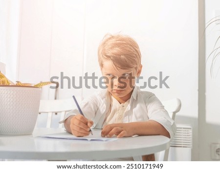 Similar – Image, Stock Photo Boy does homework