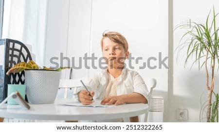 Similar – Image, Stock Photo Boy does homework