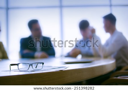 colleagues meeting to discuss their future financial plans only silhouettes being viewed