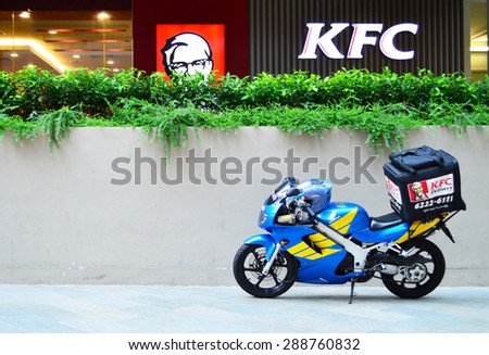 Singapore - AUG 11 - A delivery bike from KFC stand by for delivery order to customer, on Aug, 2012 in Singapore