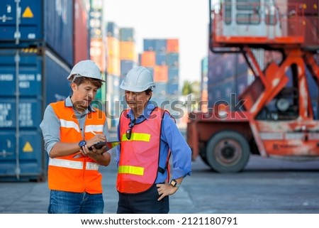 Foreman or worker work at Container cargo site check up goods in container. Foreman or worker checking on shipping containers. Logistics and shipping.	 Stock fotó © 