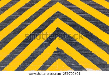Yellow and Black Stripe warning sign on the danger area.