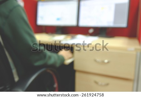 Hardworking man is monitoring his job on computer monitor.