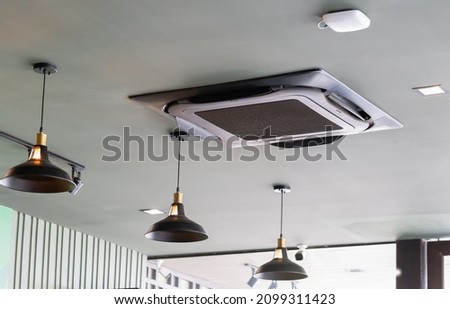 Modern ceiling mounted cassette type air conditioning system in coffee shop ストックフォト © 