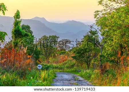 country road through the hills after sunset