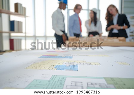 Close up building layout  design on the table with architecture people meeting at the background. Property business concept. ストックフォト © 