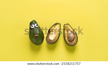 Spoiled rotten fruit vegetables cheerful avocado with yellow eyes against background copy space Stock foto © 