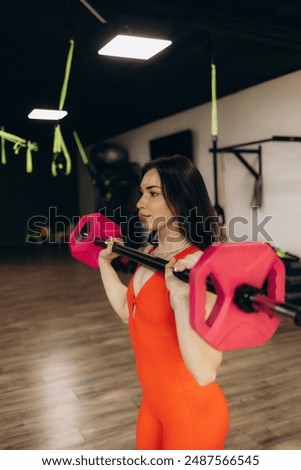 Similar – Image, Stock Photo Woman practicing weightlifting in the gym
