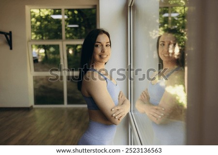 Similar – Image, Stock Photo Slim sportswoman standing near building on street