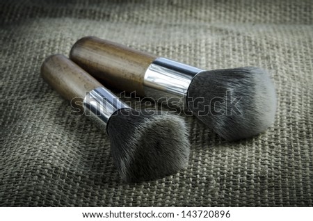 Makeup brushes on solid background