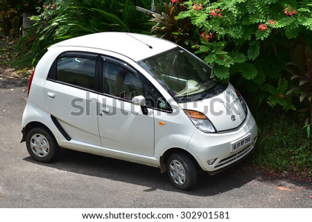 TRIVANDRUM, KERALA, INDIA, AUGUST 02, 2015: The smallest and the cheapest Indian car - Nano from Tata Motors. Small is beautiful. Twist, a full option (power- steering, - window, - brake, a/c) car.
