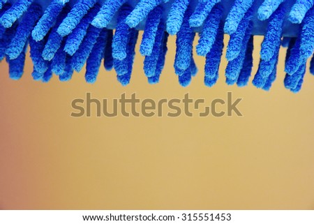 A soft blue duster made of light weight polymer fibers.