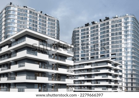 Similar – Image, Stock Photo Contemporary residential buildings and skyscrapers in city at sunset