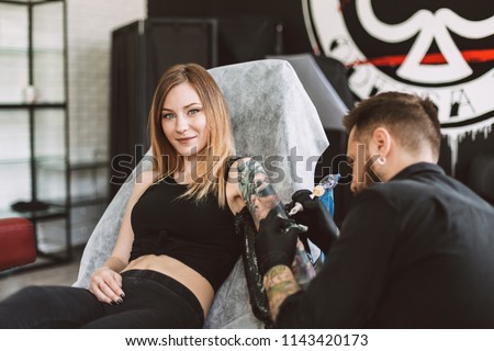 Similar – Image, Stock Photo Master doing tattoo on forearm of male customer